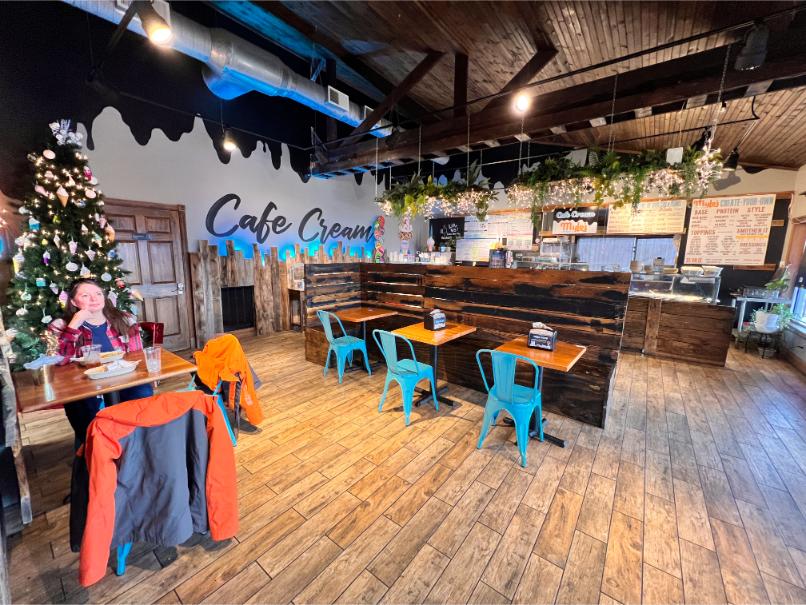 Dining area facing counter Cafe Cream and Mylo's